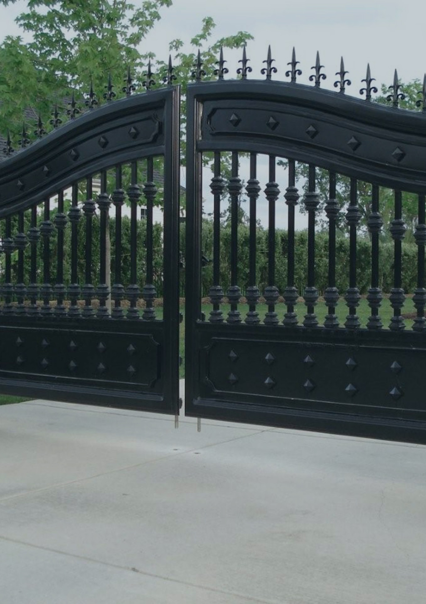 Heavy wrought-iron gate with decorative finials
